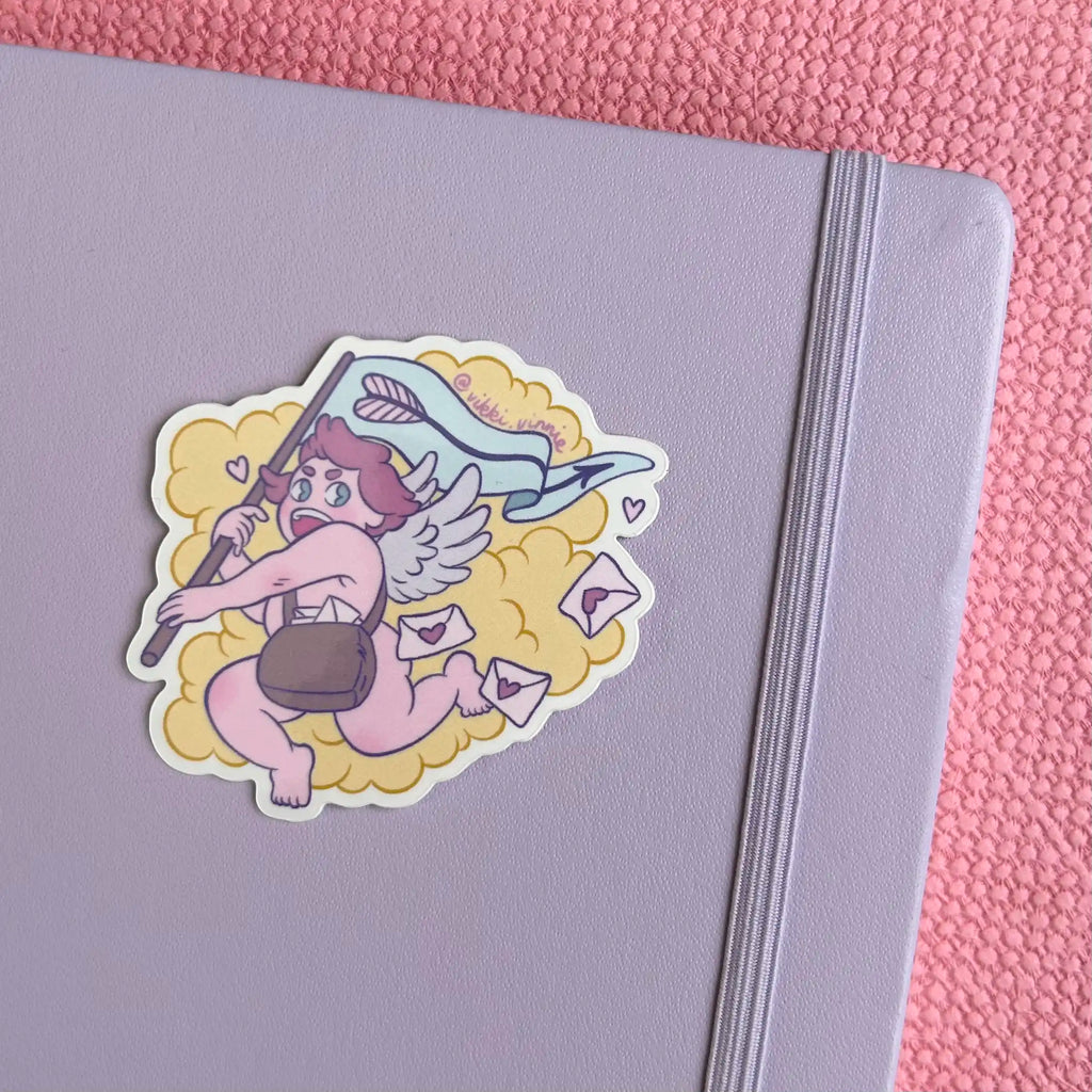 A vinyl die cut sticker designed by Vikki Vinnie depicting Cupid delivering Valentines